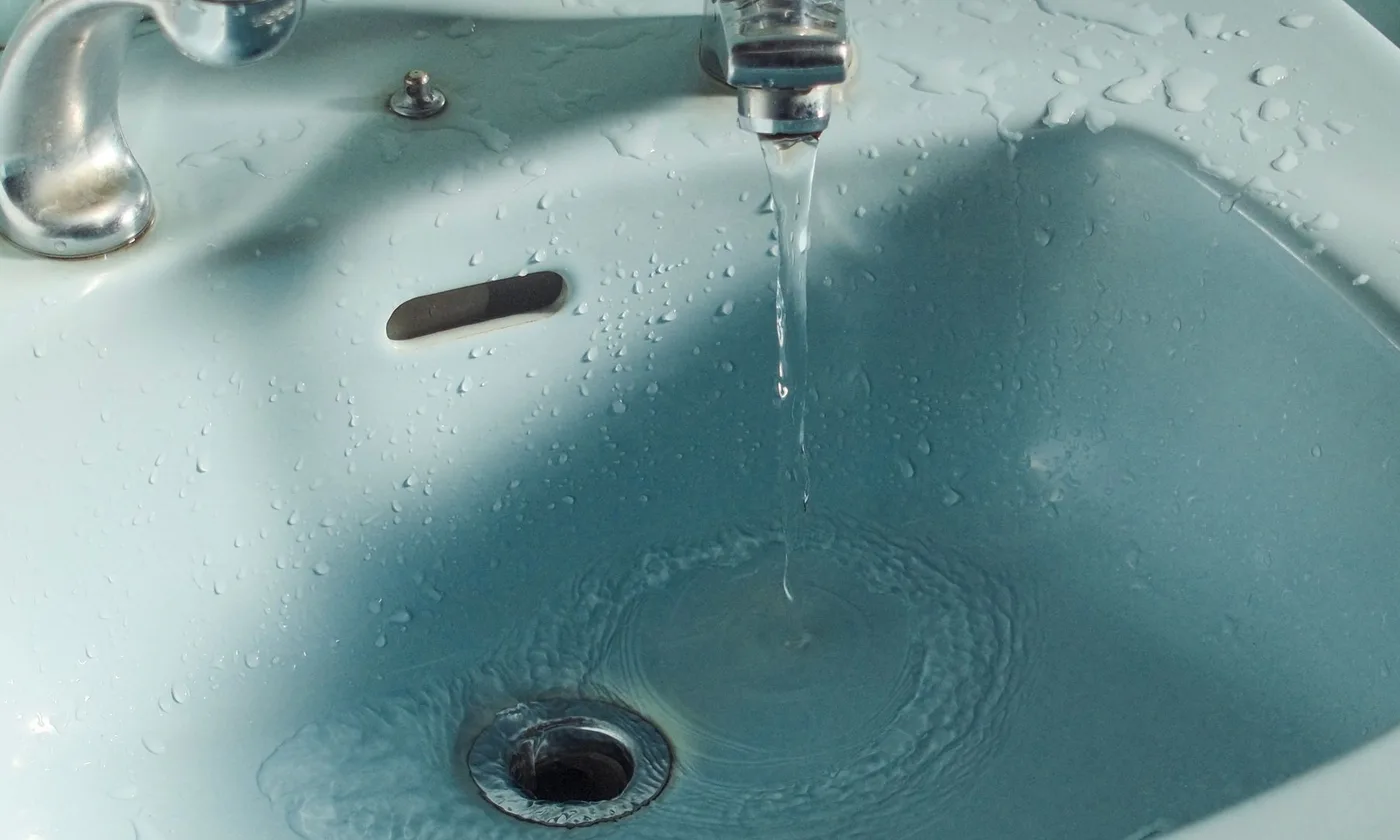 Water draining in a bathroom basin