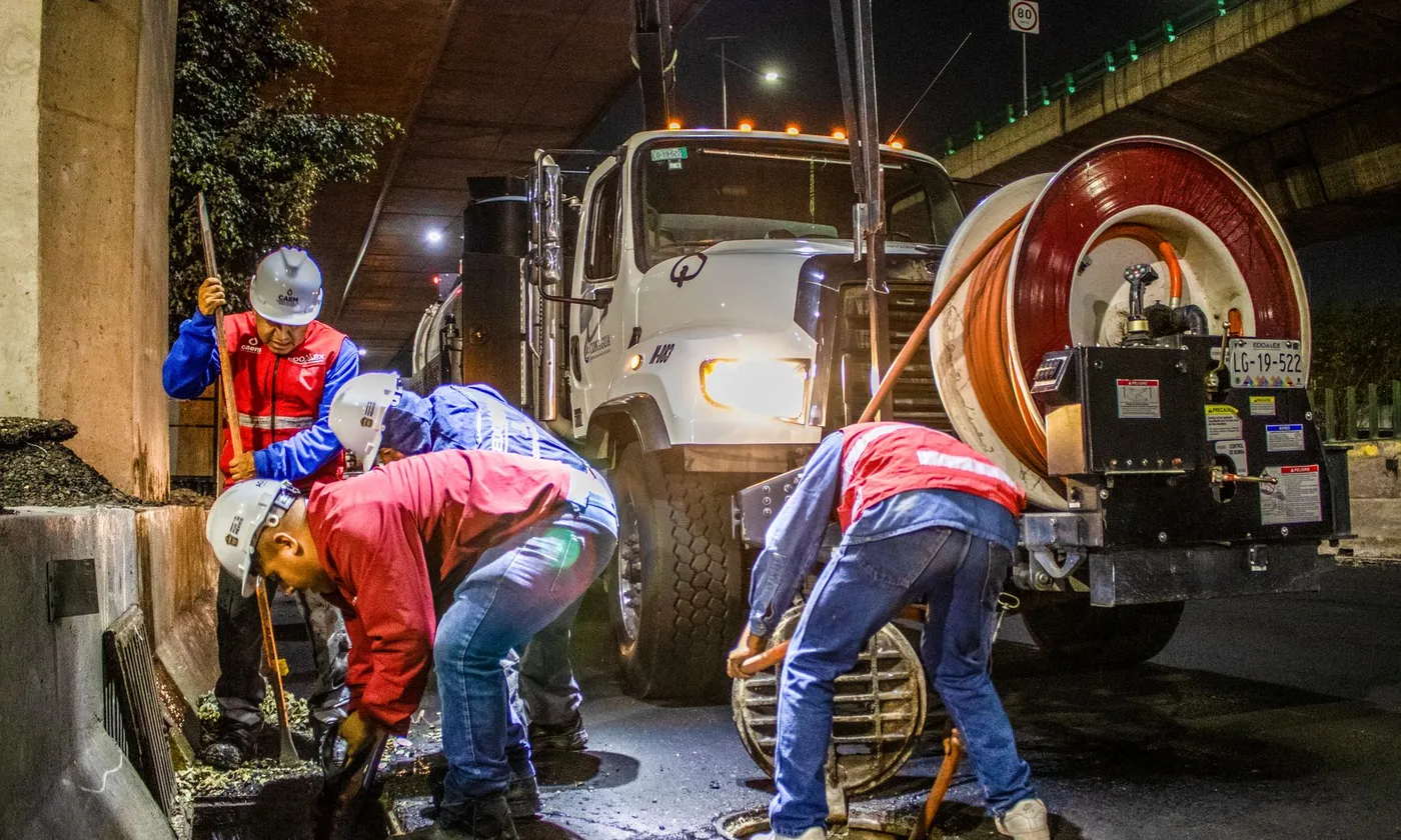 Drain and sewer cleaning crew at work