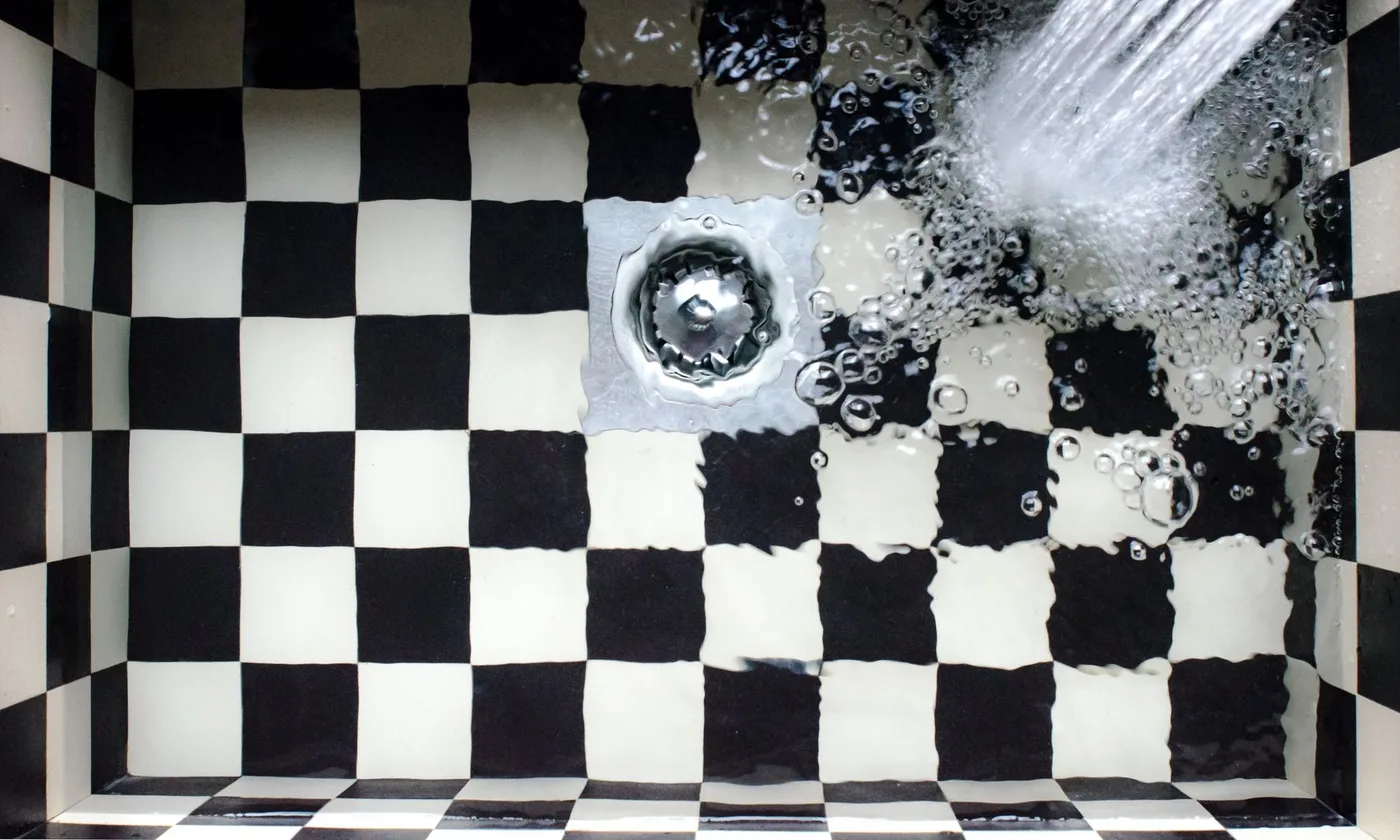 Water hitting a drain with force