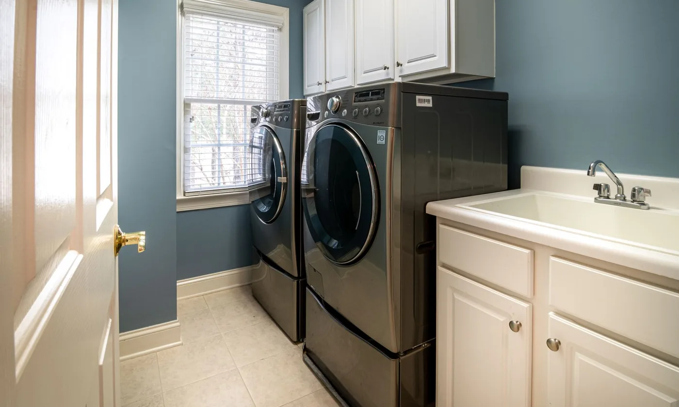Laundry room with washer and laundry tub