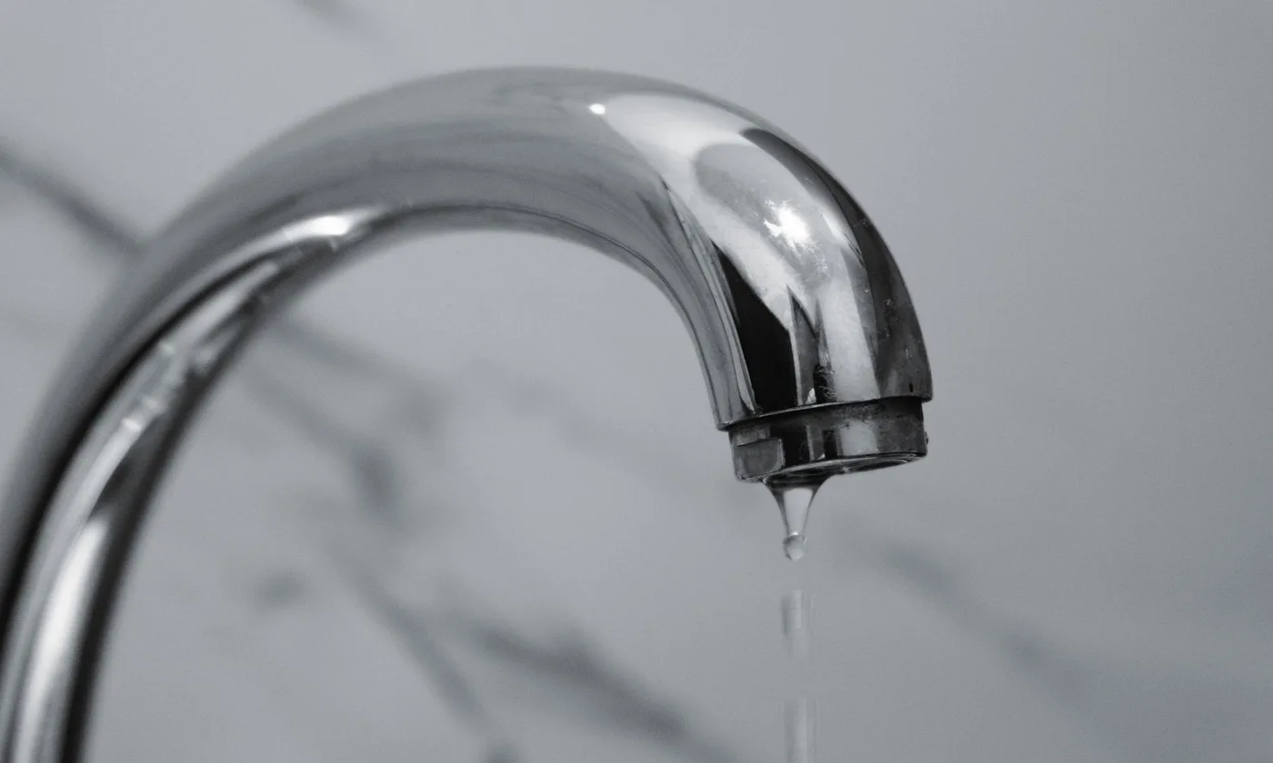Dripping chrome bathroom faucet needing repair