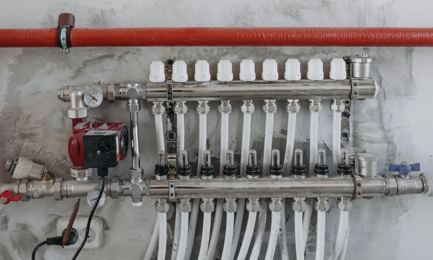 Newly installed plumbing manifold and shut-off valves